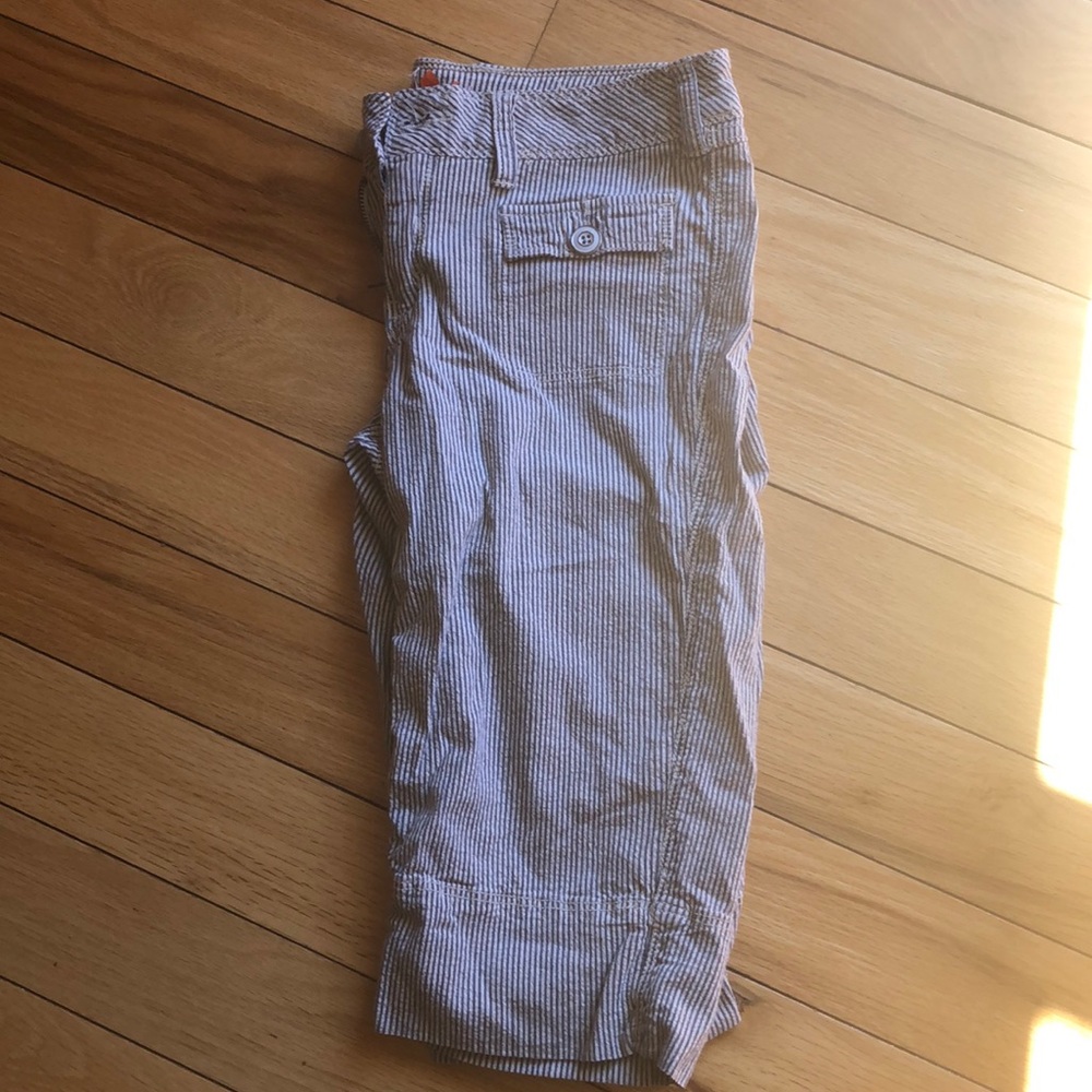 Knee length seersucker like shorts.